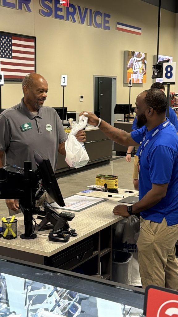 Fairview Mayor John Hubbard makes first purchase inside the new Academy Sports + Outdoors during Grand Opening on October 23, 2026. 